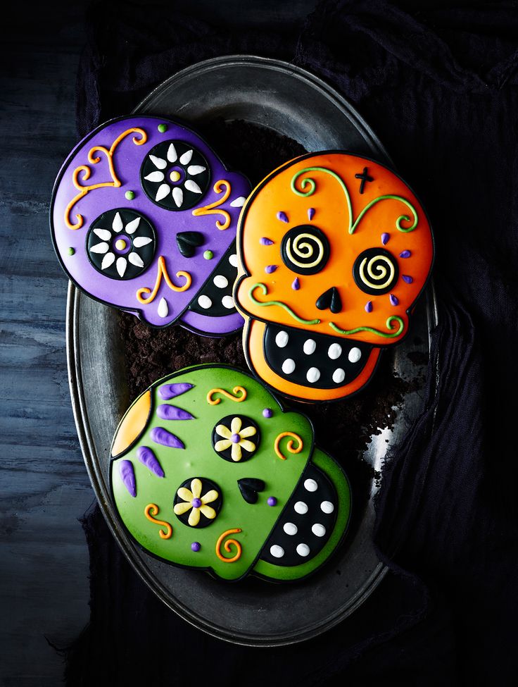 Day of the Dead Cookies made from freshly baked vanilla sugar cookies and hand decorated with royal icing. More at skullspiration.com