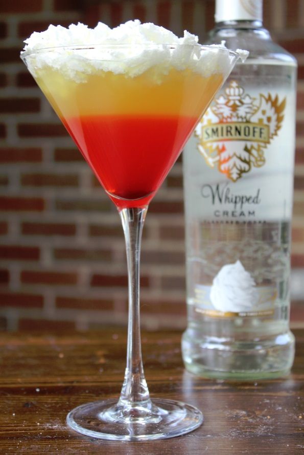 I've tried so hard to make a candy corn martini. Whipped cream. DUH!--> Halloween Candy Corn Cocktail 1 1/2 oz Smirnoff Whipped Cream Vodka 3 oz Sour Mix 2 oz Pineapple Juice 1/2 oz Grenadine Whipped cream for topping